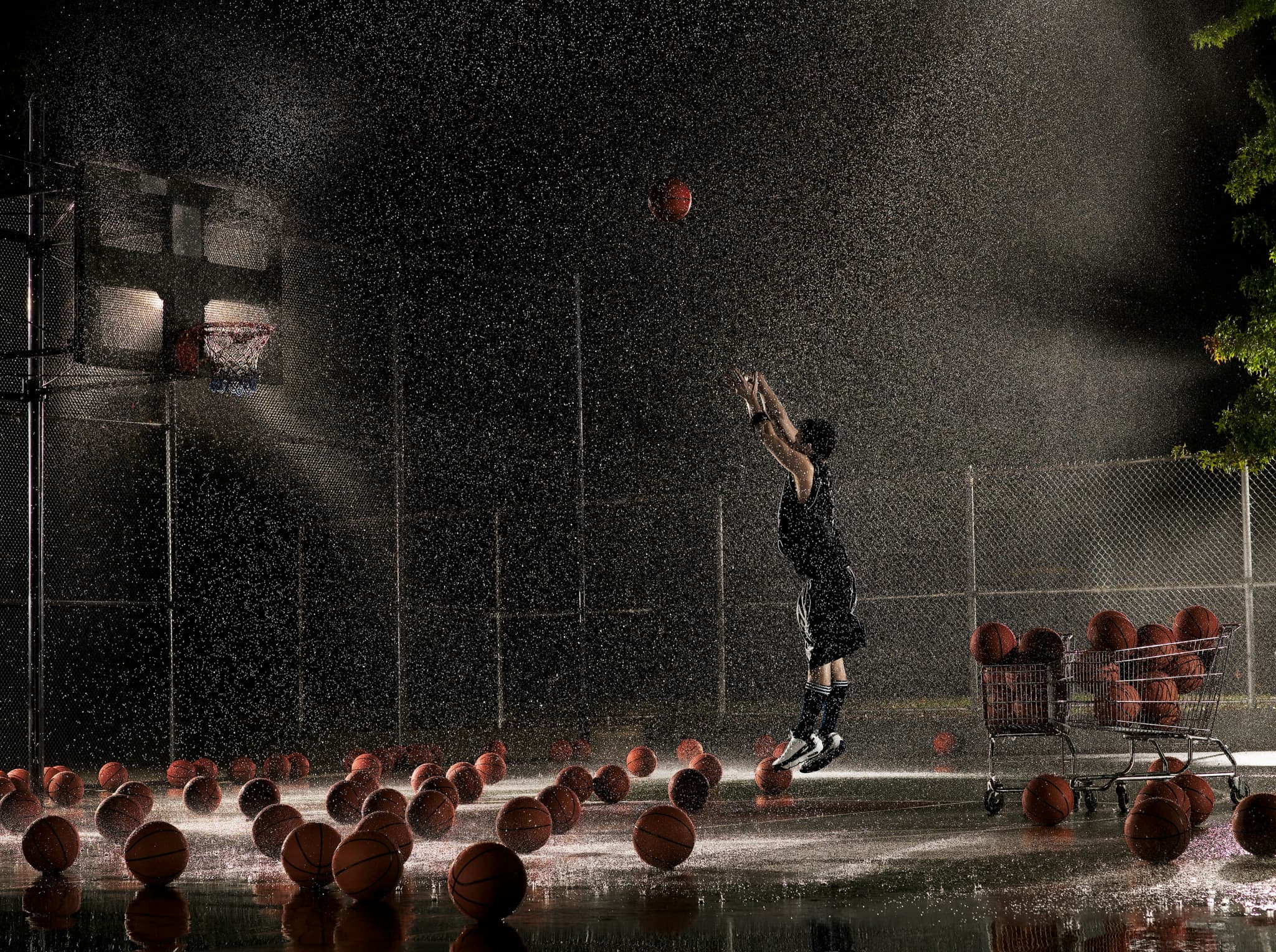 Player training outdoors in the rain